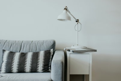 white-study-lamp-on-top-of-white-wooden-end-table-beside-gray-fabric-sofa.jpg white study lamp on top of white wooden end table beside gray fabric sofa